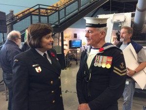 RAdm Jennifer Bennett speaking with Canadian Navy Veteran & HMCS KOOTENAY survivor Lorne Baird. Roger Litwiller Photo