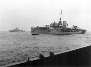 HMCS MONCTON (1st) in her wartime Admiralty Disruptive Camouflage scheme, heavily worn by hard work, and weather on the Atlantic Ocean. Photo courtesy For Posterity's Sake.