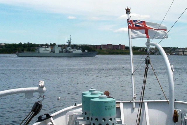 HMCS CHARLOTTETOWN a modern Canadian frigate, passes the stern of HMCS SACKVILLE, a WWII corvette on 7 July 2007. SACKVILLE is the last remaining flower class corvette in the world and is now a proud memorial to Canada's sailors in Halifax. I highly recommend a visit to this amazing ship to learn more about our veterans and how they served.

Roger Litwiller Collection, photo courtesy Roger Litwiller. (RTL100_1645)