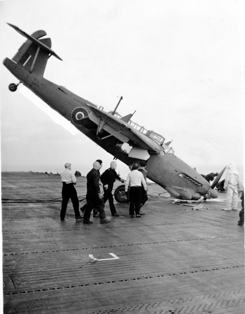 A Barracuda nosed into HMS PUNCHER's flight deck, the rear gunner was slightly injured according to Howard Abbott, the angle of the plane made rescue difficult.

Roger Litwiller Collection, courtesy Howard Abbott, RCNVR. (RTL-HA042)
