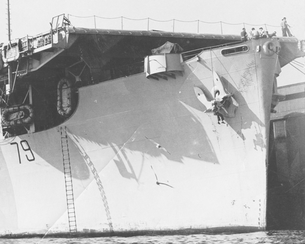 HMS PUNCHER at Vancouver to be finished to RN standards, February to May 1944. A lone sailor is over the side in a bosun's chair, painting the escort aircraft carrier's anchor, taks a close look at his spotters above on the foc's'le.

Roger Litwiller Collection, courtesy Howard Abbott, RCNVR. (RTL-HA033)