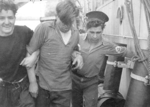 TRENTONIAN sailors Robert Cathrine and John Founier assist a “sick” friend from HMCS MOOSE JAW back to his ship. after shore leave. Roger Litwiller Collection, Allen B. Singleton, RCNVR photo, courtesy Bruce Keir, RCNVR.