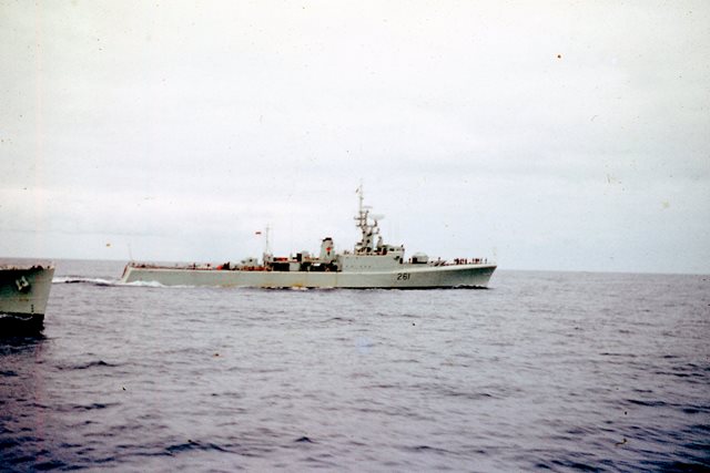 HMCS MACKENZIE steams ahead of HMCS BEACON HILL. Photo taken from HMCS SASKATCHEWAN while the three ships were on a Far East Cruise in 1965. Roger Litwiller Collection, courtesy Brian Rideout. RTL-BR066)